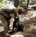 Specialized search dog trains in IED detection during Mountain Warfare Training