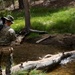 Specialized search dog trains in IED detection during Mountain Warfare Training