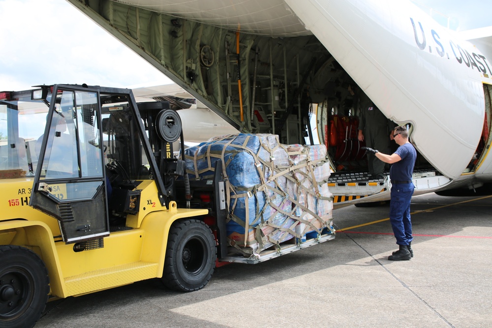 Coast Guard crews prepare supplies for Hurricane Harvey relief