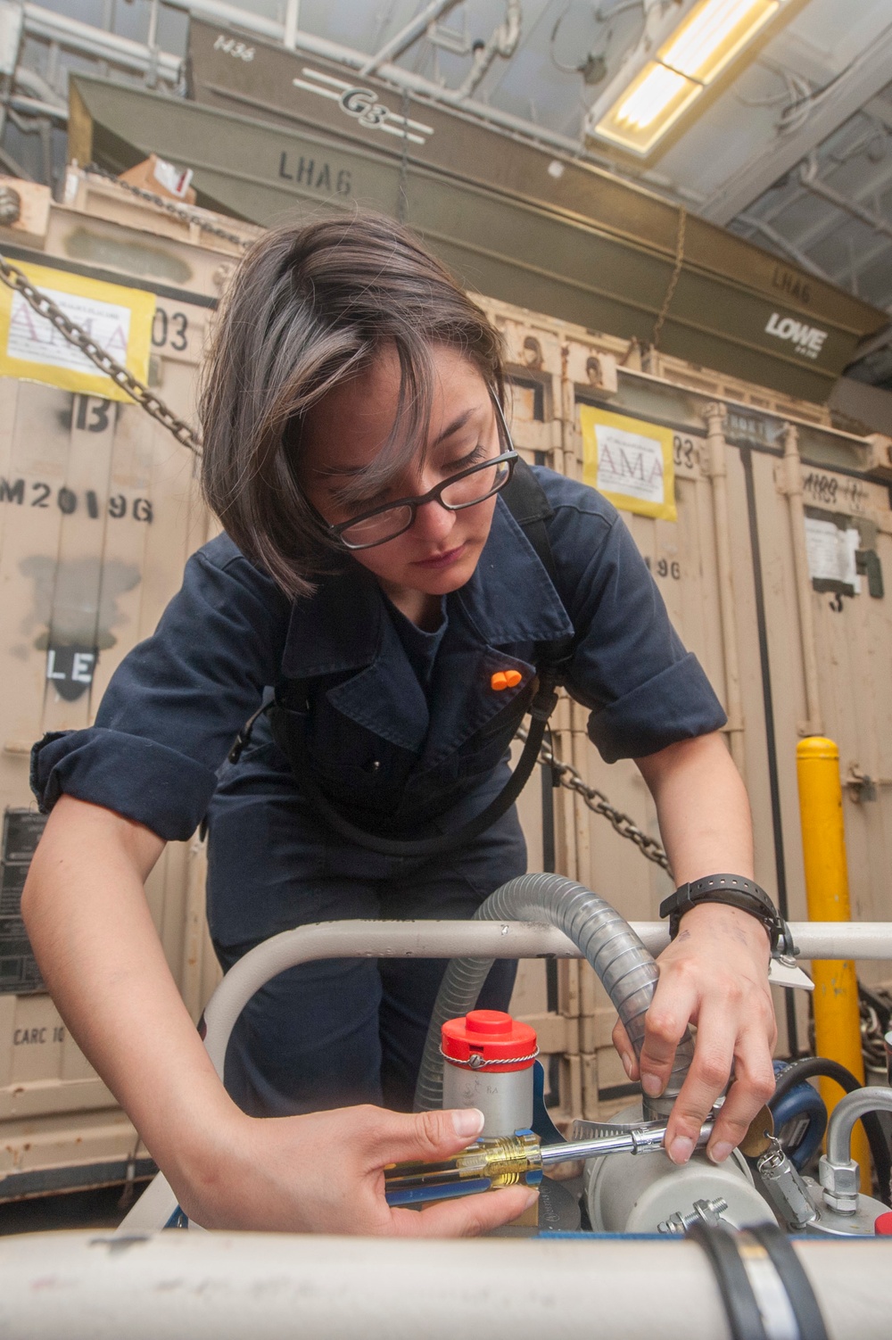 Sailors replaces hose lines