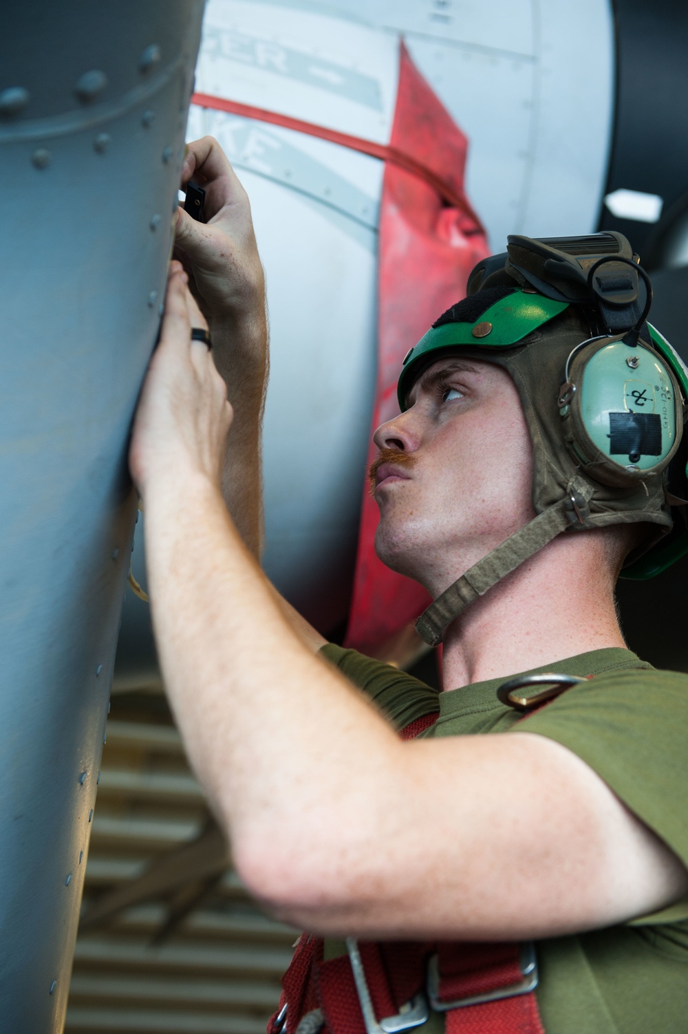 Marine conducts works on MV-22 Osprey