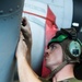 Marine conducts works on MV-22 Osprey