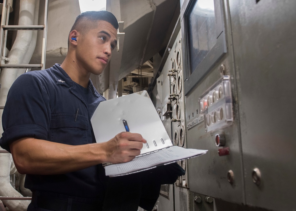USS Lake Erie (CG 70) Sailor completes generator readings