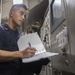 USS Lake Erie (CG 70) Sailor completes generator readings