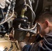 USS Lake Erie (CG 70) Sailor replaces fuel pump