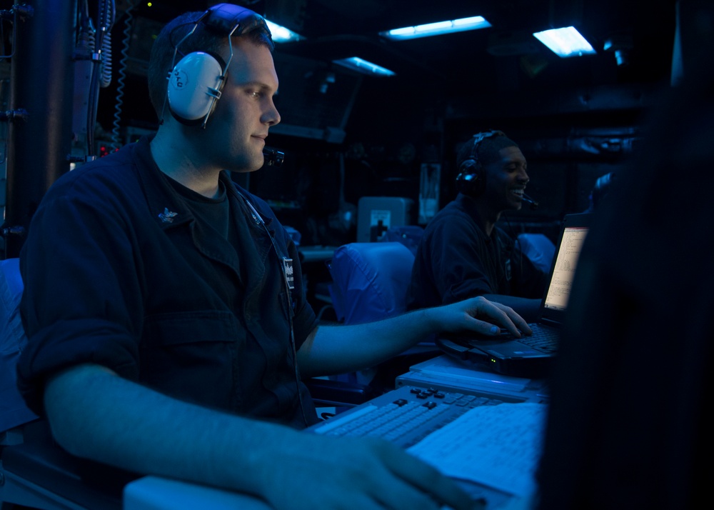 USS Lake Erie (CG 70) Sailor stands Air Warfare Coordinator watch
