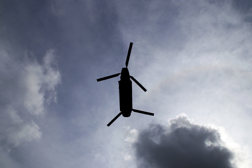 Texas Military Department soldiers and airmen load hay bales as part of Operation Hay Drop