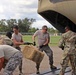 Texas Military Department soldiers and airmen load hay bales as part of Operation Hay Drop