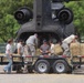 Texas Military Department soldiers and airmen load hay bales as part of Operation Hay Drop