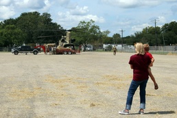 Texas Military Department soldiers and airmen load hay bales as part of Operation Hay Drop