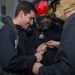 Sailors assigned to the amphibious assault ship USS Bonhomme Richard (LHD 6) take part in an at-sea fire party drill.