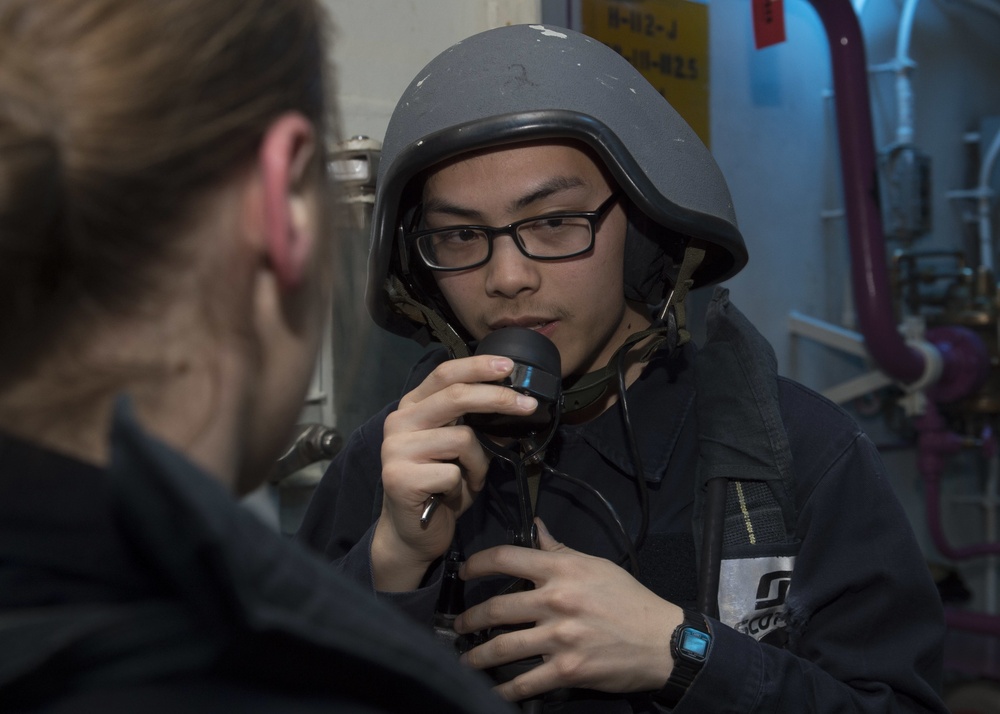 Sailors assigned to the amphibious assault ship USS Bonhomme Richard (LHD 6) take part in an at-sea fire party drill.