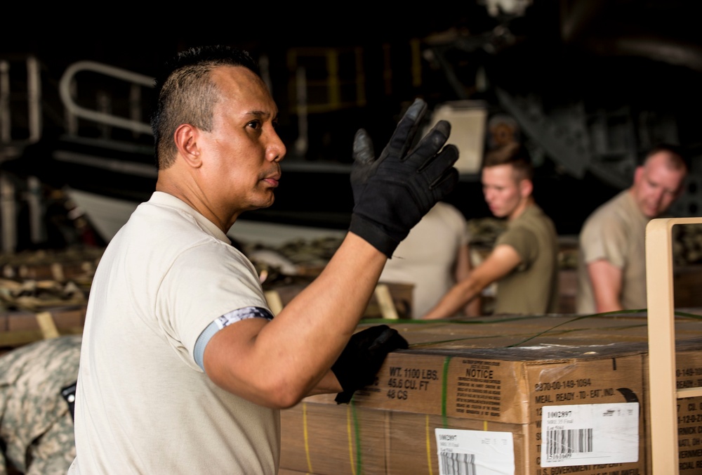 Soldiers and Airmen pack meals for Florida residents affected by Hurricane Irma