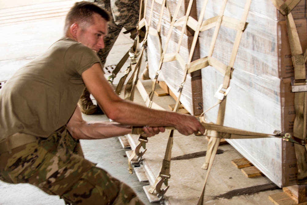 Soldiers and Airmen pack meals for Florida residents affected by Hurricane Irma