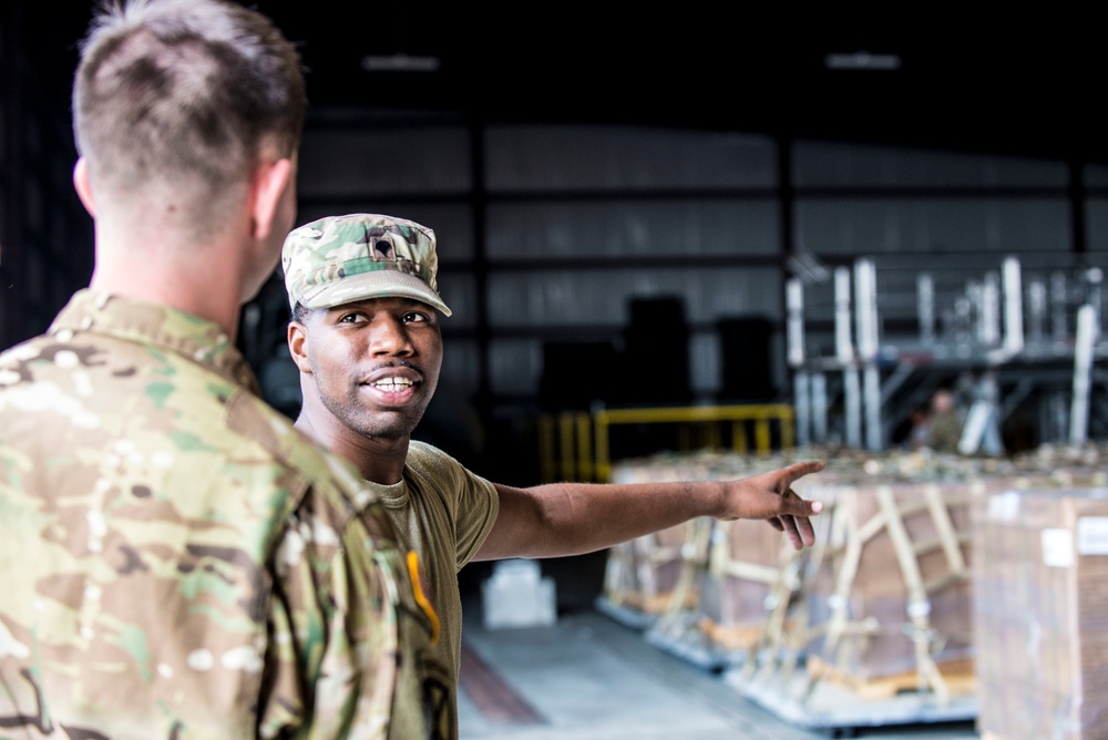 Soldiers and Airmen pack meals for Florida residents affected by Hurricane Irma