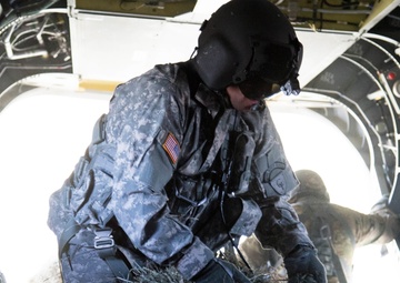 Texas Guard aviator guides helicopter deliveries of hay to stranded cattle in Texas