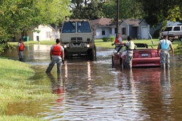 Texas National Guard Soldiers distribute food and supplies to stranded residents in Orange