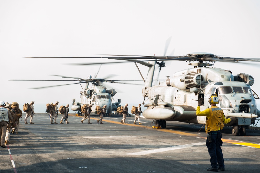 Marines board an MH-60S helicopter