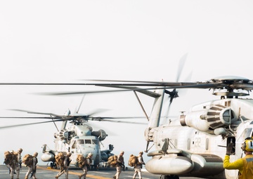 Marines board an MH-60S helicopter