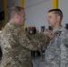 Brigade Commander pins Meritorious Service Medal onto Outgoing Battalion Commander