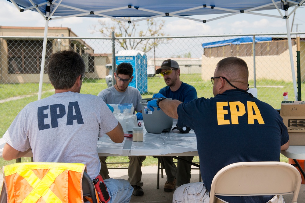 EPA responders test samples from recovered containers