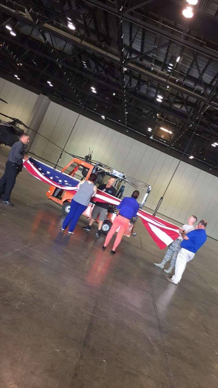 Airmen, Orlando convention center employees raise flag where aircraft bedded down