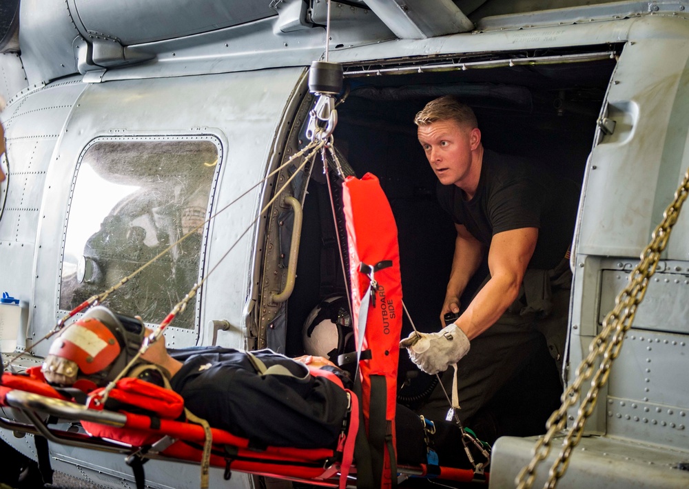 Sailors perfrom medical evacuation procedures aboard USS New York