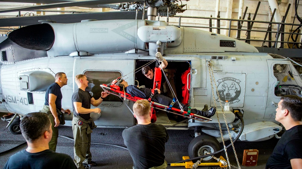 Sailors perfrom medical evacuation procedures aboard USS New York