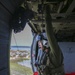 Air Crewman (Helicopter) 1st Class Mike Andrew searches Key West during a reconnaissance mission, inside an MH-60S Sea Hawk, from the Nightdippers of Helicopter Sea Combat Squadron (HSC) 5