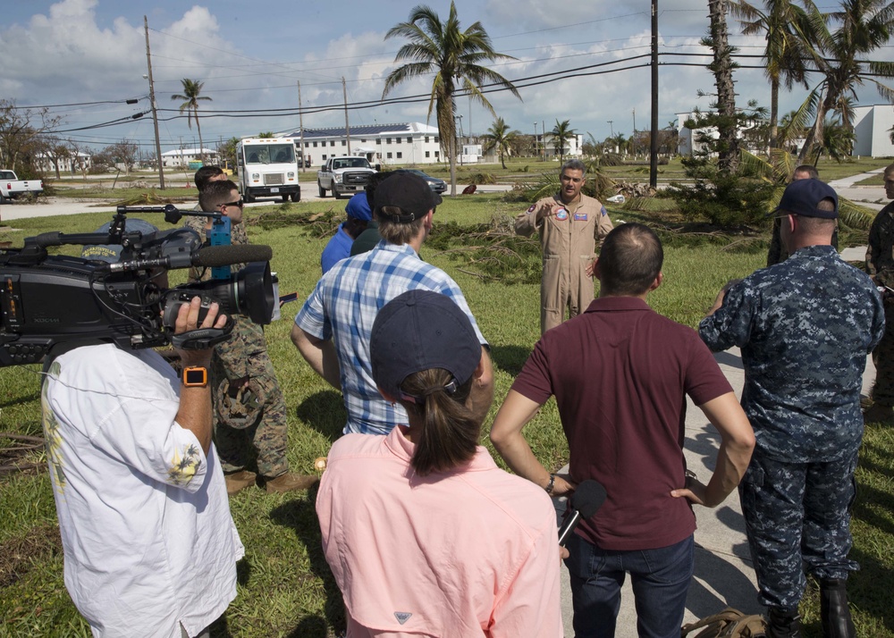 Capt. Bobby Baker, commanding officer of Naval Air Station Key West, answers questions during a press conference while touring the air station and local area