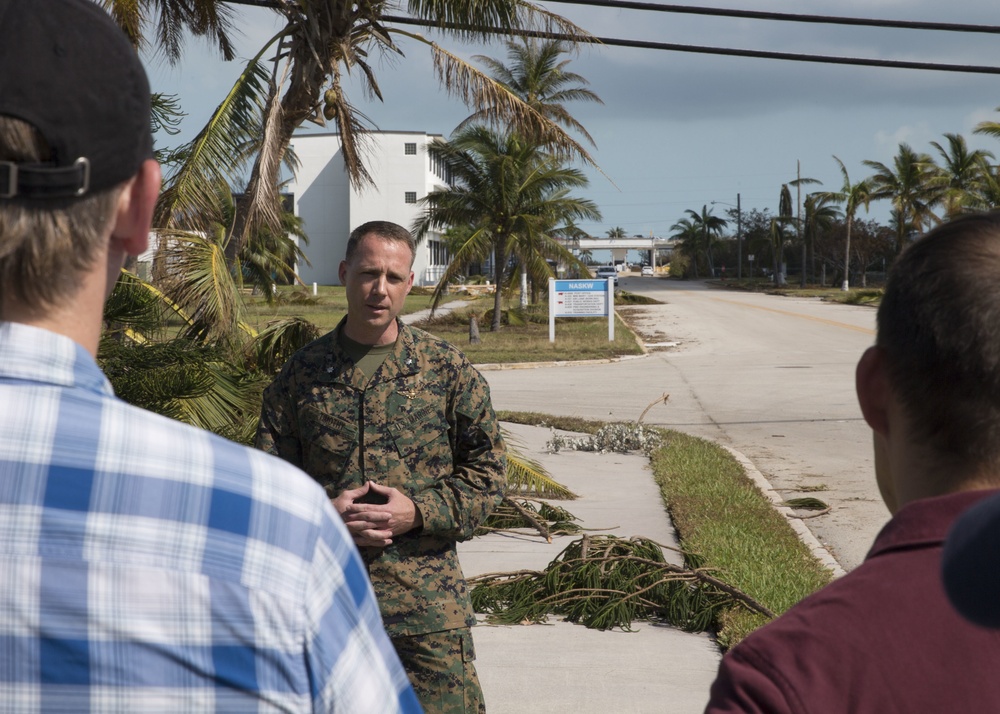 Lt. Col. Christopher Timothy, executive officer of the 26th Marine Expeditionary Unit, answers questions during a press conference while touring the air station and local area