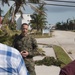 Lt. Col. Christopher Timothy, executive officer of the 26th Marine Expeditionary Unit, answers questions during a press conference while touring the air station and local area