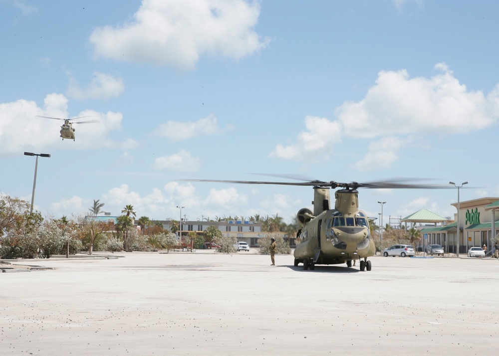CH-47 Chinooks assigned to Florida Army National Guard Air Operations 1st Battalion, 11th Aviation Regiment, offload food and water at a FEMA distribution center in Key West