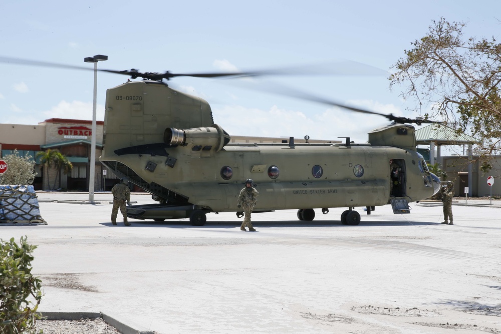 CH-47 Chinooks assigned to Florida Army National Guard Air Operations 1st Battalion, 11th Aviation Regiment, offload food and water at a FEMA distribution center in Key West