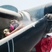 Marine conducts maintenance on MV-22 Osprey