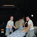Westover ARB aerial porters unload supplies from a C-5 at Homestead ARB