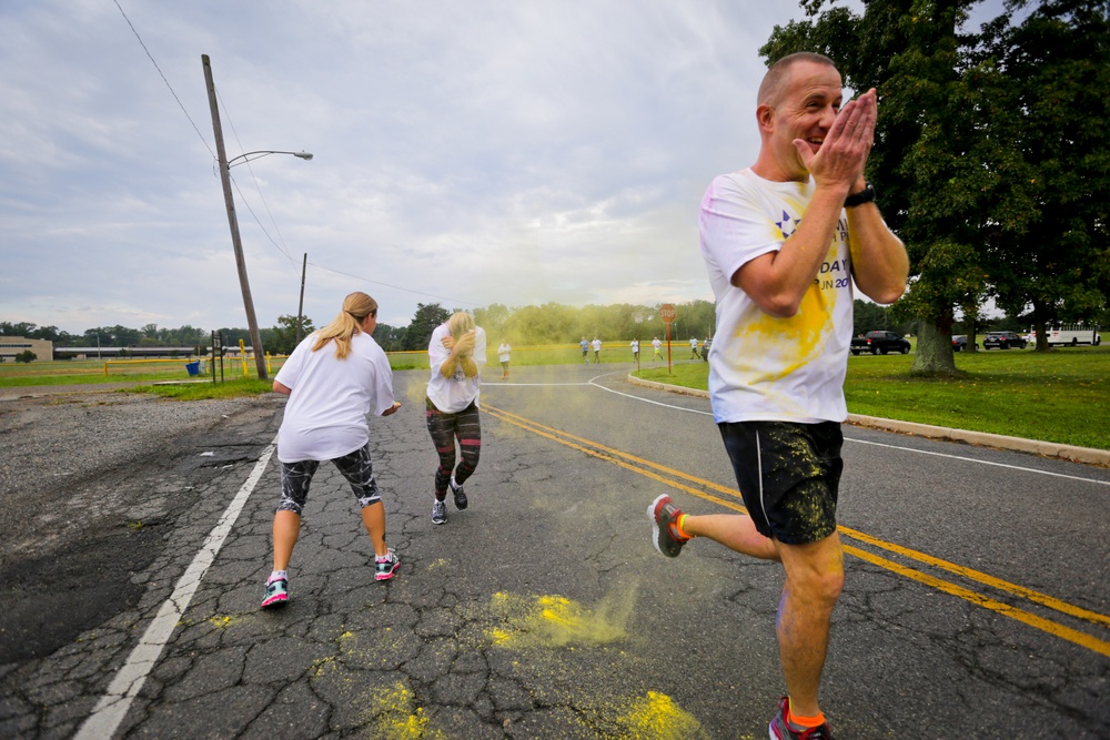 Soldiers and Airmen participate in Unity Day 5K Color Run