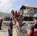 Coast Guard cutter Valiant crew members assist St. John evacuees as they prepare to leave the U.S. Virgin Islands