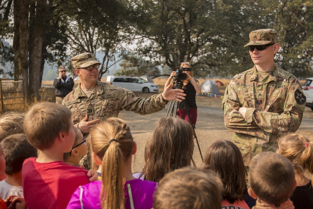 Soldiers Speak With Visiting School Children