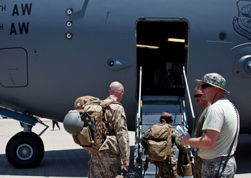 Service members with JTF-LI prepare a C-17 for departure in support of HADR.