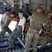 Service members with JTF-LI prepare a C-17 for departure in support of HADR.