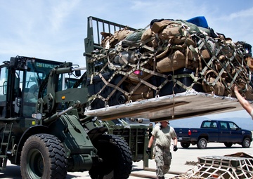 Service members with JTF-LI prepare a C-17 for departure in support of HADR.