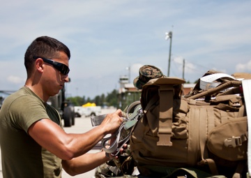 Service members with JTF-LI prepare a C-17 for departure in support of HADR.