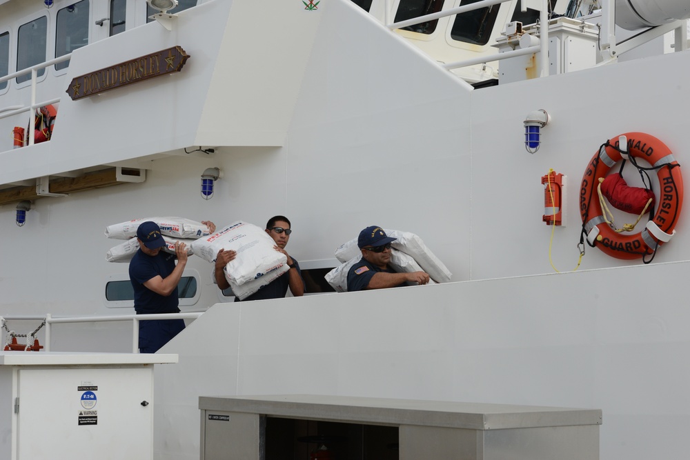 Coast Guard Cutter Donald Horsley crew loads dog food, pet medicine, and other supplies for U.S. Virgin Islands