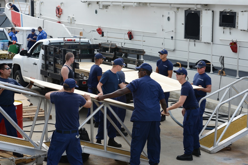 Coast Guard Cutter Donald Horsley crew load supplies for U.S. Virgin Islands