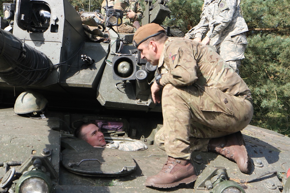 Soldiers of the Michigan Army National Guard’s C Co. 1-125IN Learn about the British Challenger 2 Tank