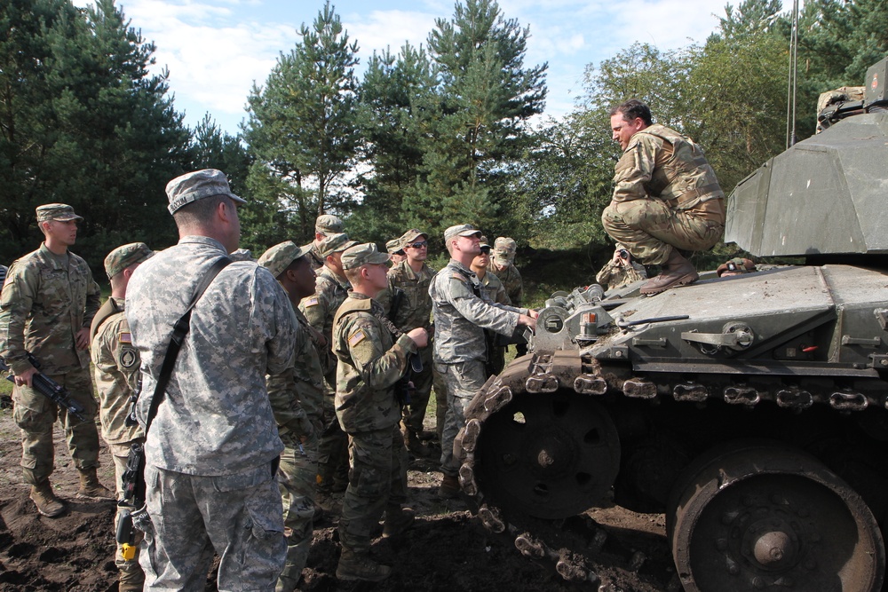 Soldiers of the Michigan Army National Guard’s C Co. 1-125IN Learn about the British Challenger 2 Tank