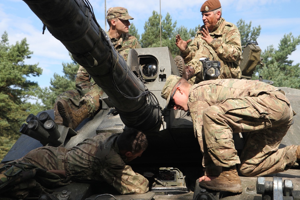 Soldiers of the Michigan Army National Guard’s C Co. 1-125IN Learn about the British Challenger 2 Tank