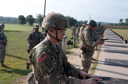 Sgt. Newlon prepares his M-9 pistol during close engagement match