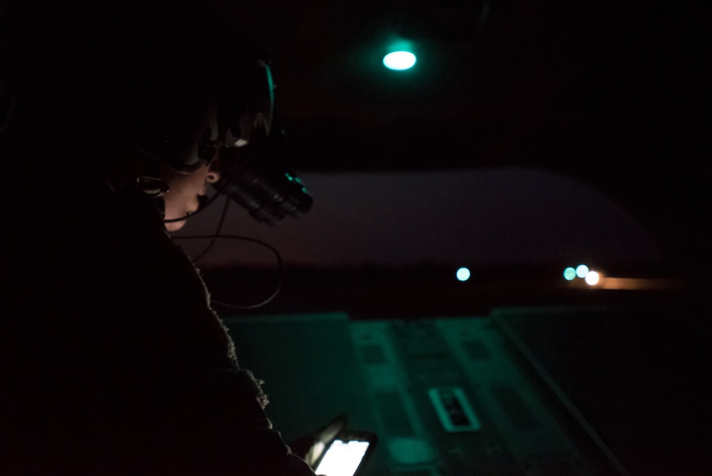 Chinook crew member prepares for air assault